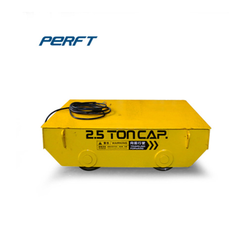 Towed cable powered industrial rail material transportation and transfer vehicle, a heavy-duty material friendly transfer vehicle