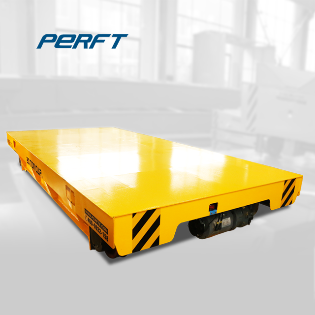 Battery-powered transport vehicleActual shot of a yellow electric flatbed battery-powered transfer cart, suitable for material transportation in factory areas