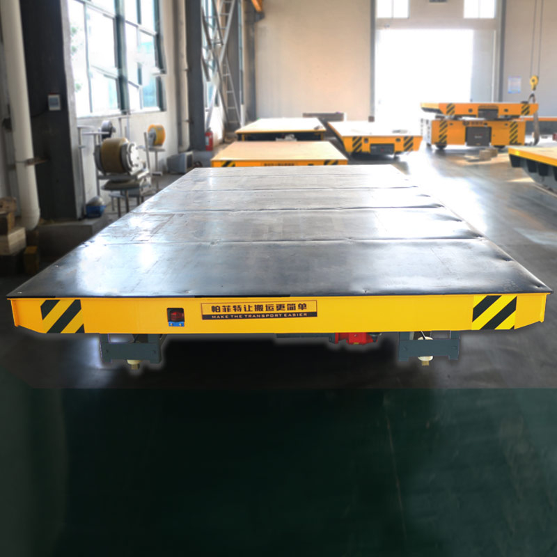 Battery-Powered Rail-Guided Cart - industrial material handling equipment with battery power/trail trailers