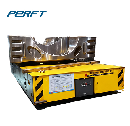 Trackless transfer cart transporting heavy industrial components - material handling equipment